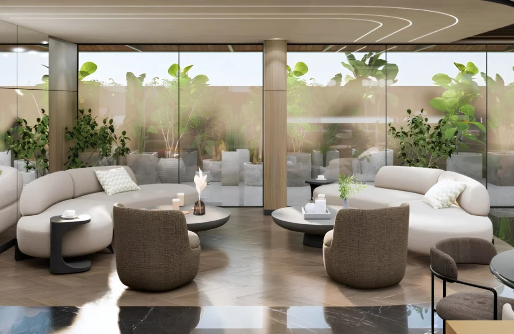 Premium managed office space lounge with modern seating, collaborative breakout areas, floor-to-ceiling glass windows, and lush greenery, showcasing one of the best managed office spaces near Hitech City, Hyderabad.